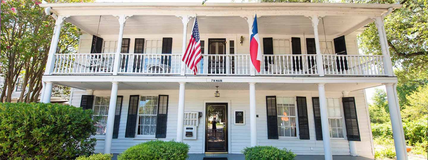 white house with flags in texas